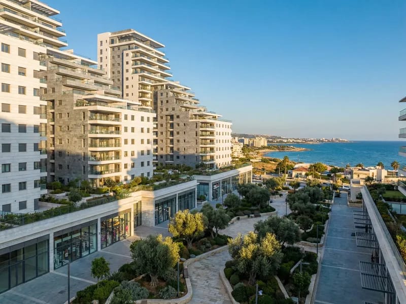 Modern mixed-use residential and commercial development complex in a Mediterranean coastal city